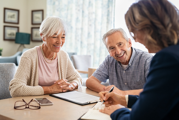 Senior couple planning their investments with financial advisor